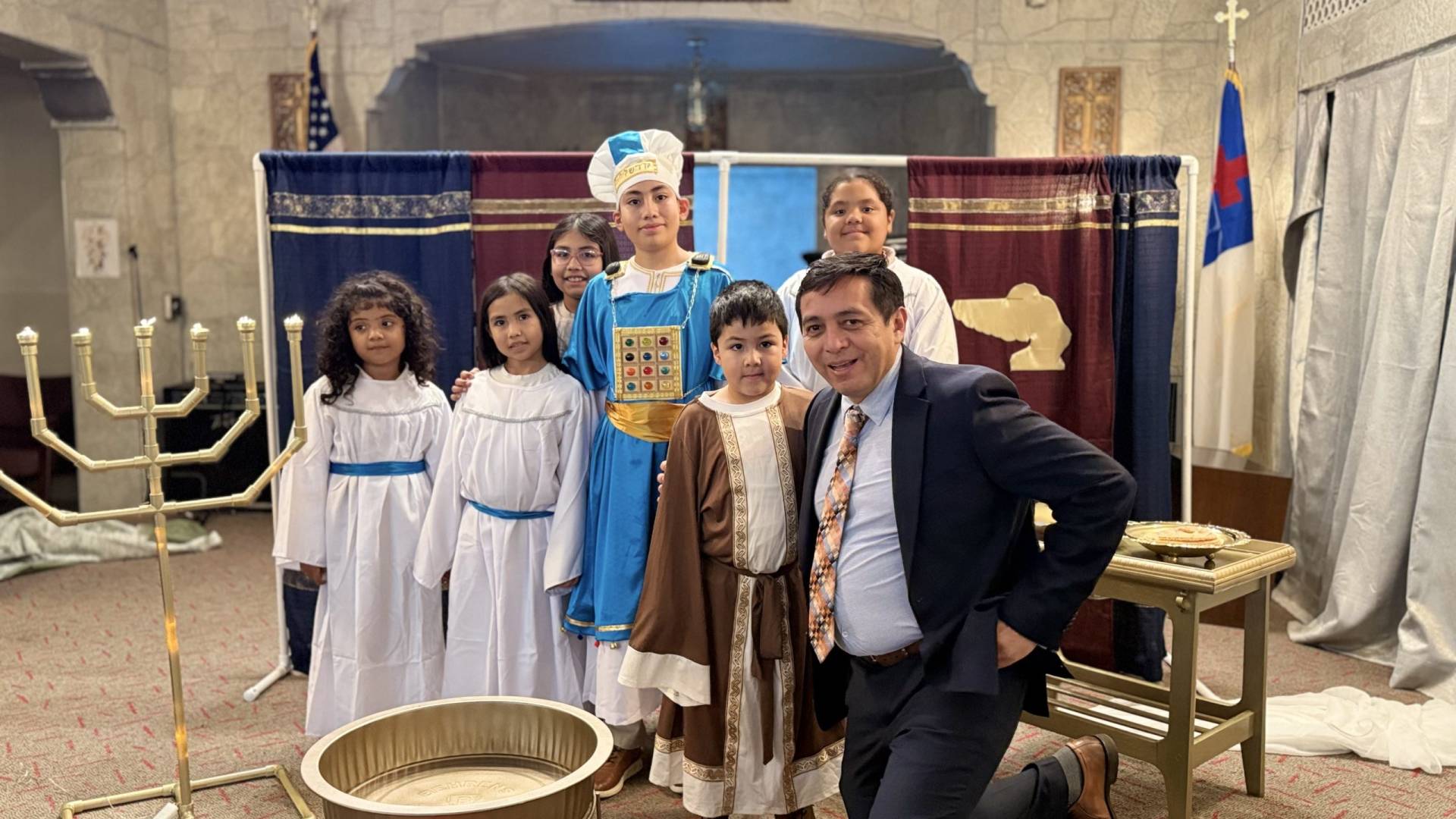 Children participating in a church Bible presentation